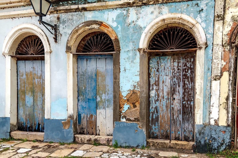 Blue wooden doors on an old house in the historic town of Alcantara, Maranhao, Alcantara, Maranhao, Brazil
