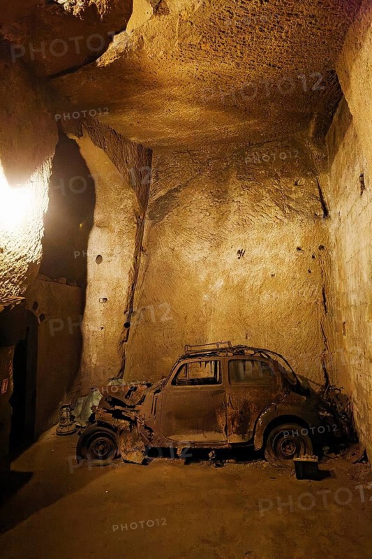 Rotten Lancia Aurelia from the 1950s, car cemetery, Galleria Borbonica, Bourbon Tunnel, underground Naples, Campania province, Italy