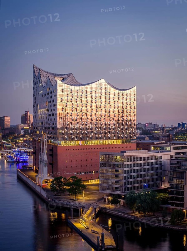 Aerial view of sunrise on the Elbe with Elbe Philharmonic Hall and reflections in the glass façade, Hamburg, Germany