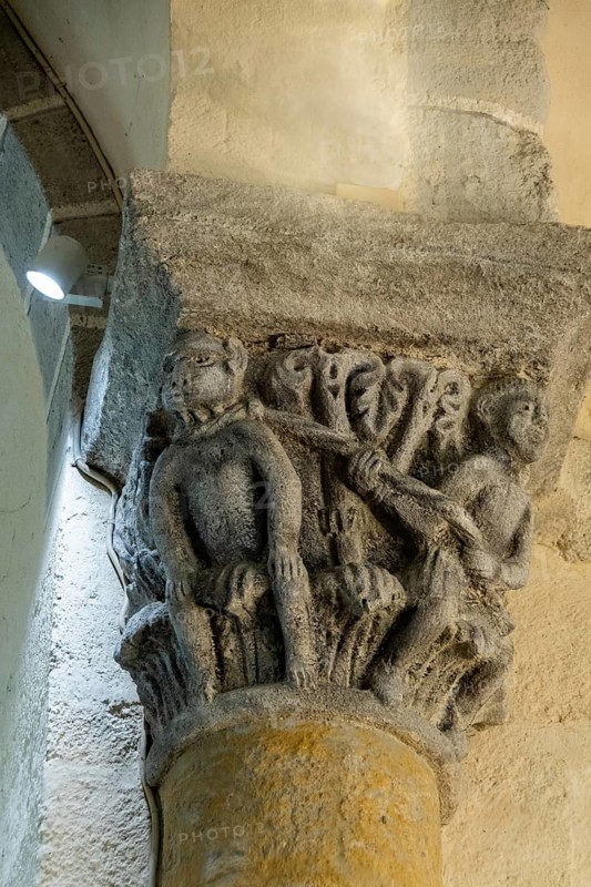Capital of romanesque church of Saint Nectaire, Tethered Monkey, Puy de Dome, Auvergne Rhone Alpes, France