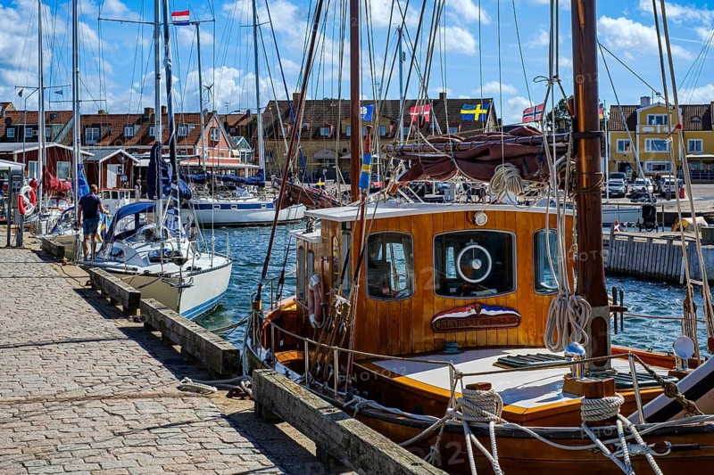 Maritime atmosphere: sports boats and sailing yachts on the quay in Torekov harbour, Skåne, Sweden. A maritime atmosphere: Sport Boats and Sailing Yachts moored at the Quay in the Harbour of Torekov, Scania, Sweden