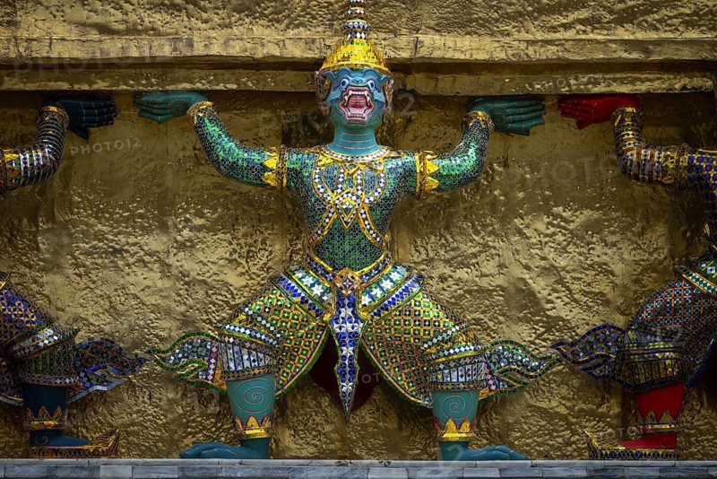 A row of giants supporting a chedi (all the giants surrounding the chedi are figures from the Ramakien), Wat Phra Kaeo (Temple of the Emerald Buddha), Grand Palace, Bangkok, Thailand