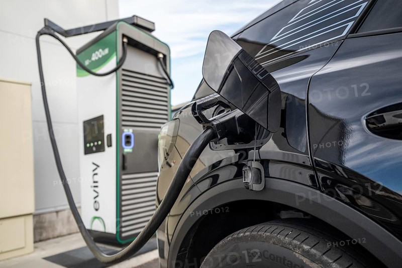 Fully electric Ford Explorer charging cable in electric tank Eviny electric vehicle charging station Norway