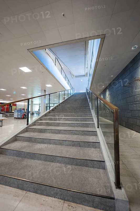 Modern staircase with glass railing in a bright office building, state parliament of Baden-Württemberg, Stuttgart, Germany