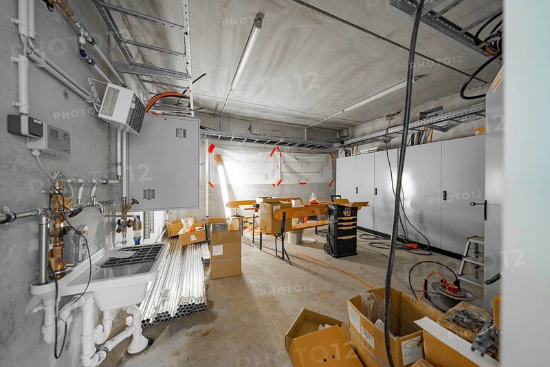 A storage room with boxes, tools and materials, ready for use on a construction site, parking garage construction, Calw, Germany