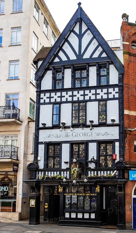 The George, a Victorian half-timbered rebuild of an 18th century coffee house, stands opposite the Royal Courts of Justice, The Strand, London, England, United Kingdom