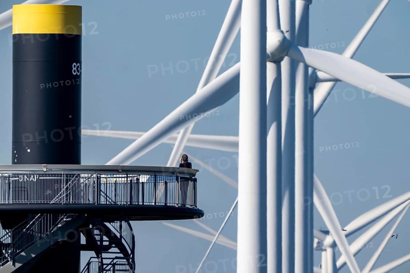Viewing platform at Landtong Rozenburg wind farm, Noordzeeweg, Paal 83 watchtower 22 meters high, behind it 11 Vestas wind turbines, with an output of 34 MW and an annual result of 117 gigawatts, which corresponds to the consumption of approximately 43, 000 households, on a promontory on Nieuwe Waterweg, at Europoort harbour, hub height 130 meters, rotor diameter 26 meters, near Rotterdam, the Netherlands