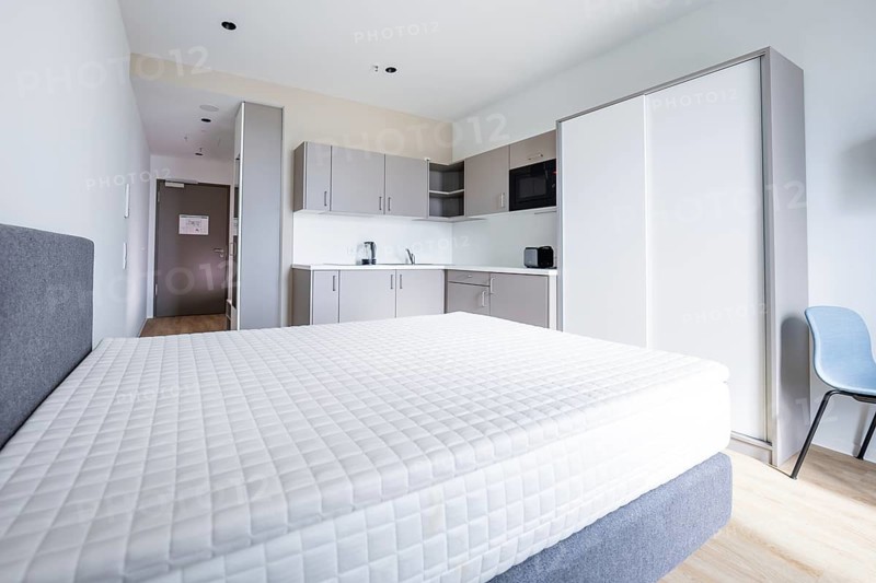 A modern studio apartment with kitchen, bed and bright, minimalistic design, Boarding House of Klinikverbund Südwest, Böblingen, Germany