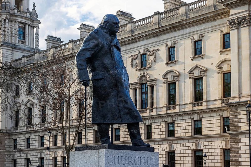 Ivor Roberts-Jones's bronze statue of Sir Winston Churchill stands in Parliament Square before the Whitehall skyline, London, England, United Kingdom