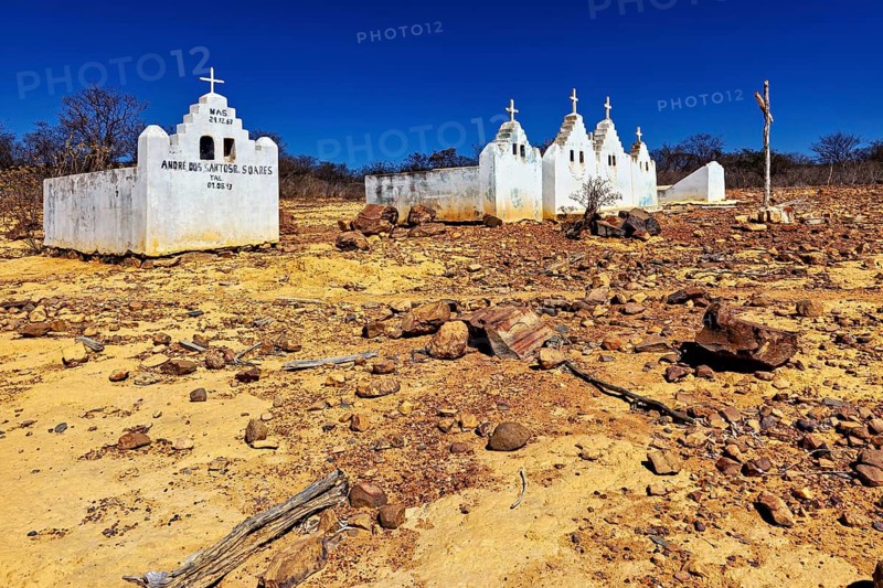 Abandoned church in a dry desert landscape under a clear blue sky, cemetery in the spiny savanna of Caatinga in the federal states of Pernambuco and Bahia in Brazil