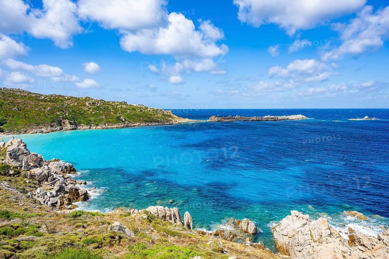 Coastline with emerald green and blue water on a sunny day at Santa Teresa di Gallura, Sardinia, Italy