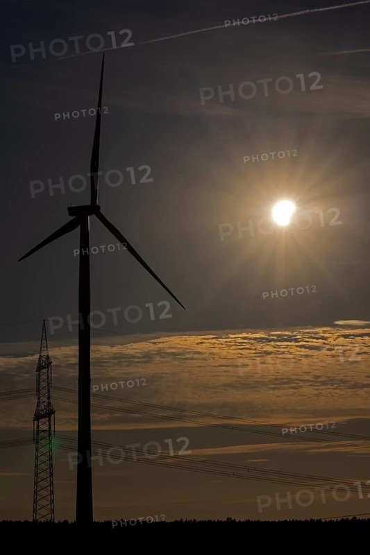 Wind power plant, high-voltage pylon, clouds, contrails, partial solar eclipse, Melbeck, Samtgemeinde Ilmenau, Lower Saxony, Germany