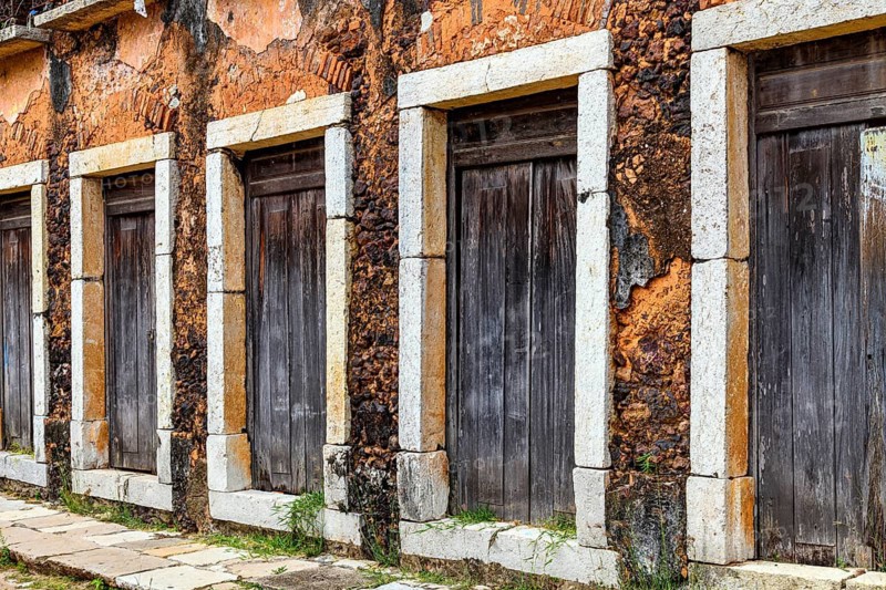 Wooden doors with stone frames in a historic 17th-century building in the city of Sao Luis, Maranhao, Sao Luis, Maranhao, Brazil