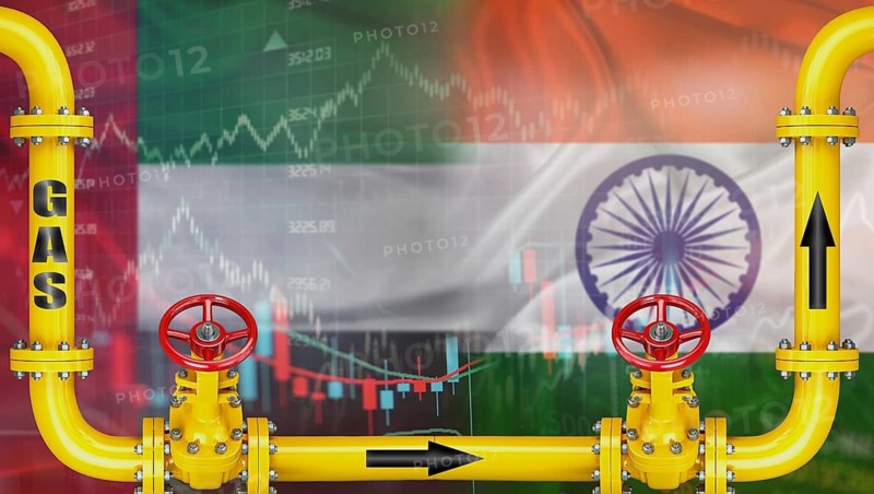 Gas exports from the United Arab Emirates to India on financial chart background. Emirati gas export pipeline to India
