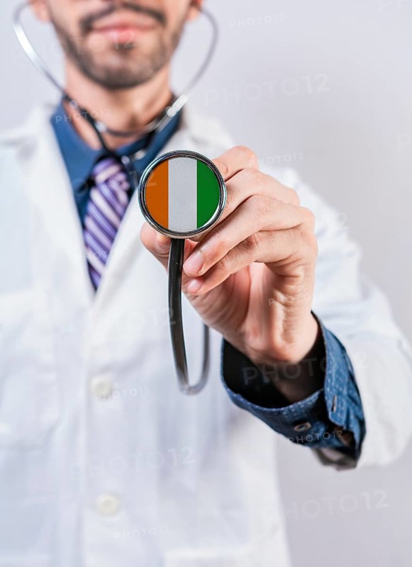 Ivory Coast health and medical insurance concept. Ivory Coast healthcare system, doctor holding stethoscope