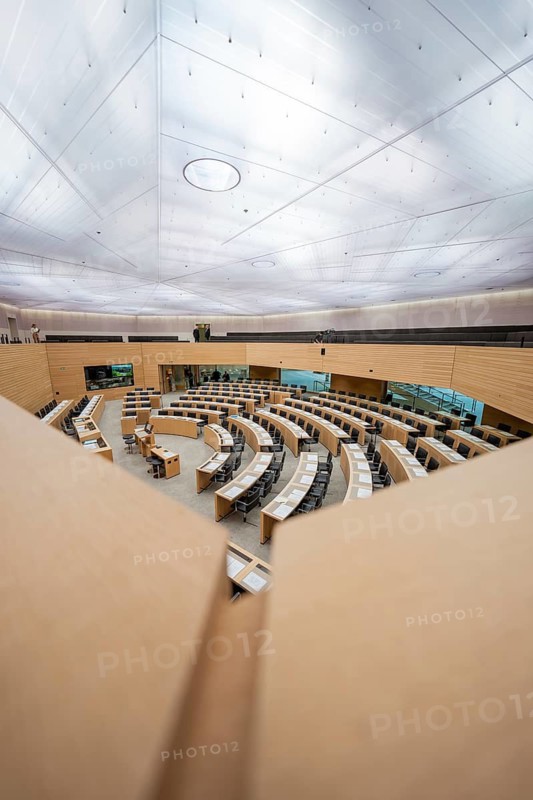 Modern hall, ready for duty with curved tables under a glass dome, state parliament of Baden-Württemberg, Stuttgart, Germany
