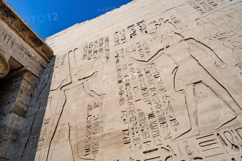 The art of ancient Egyptian story telling with carvings, reliefs and Hieroglyphs, Medinet Habu, the ancient Egyptian Mortuary Temple of Ramesses III on the West Bank of The Nile, Luxor, Egypt
