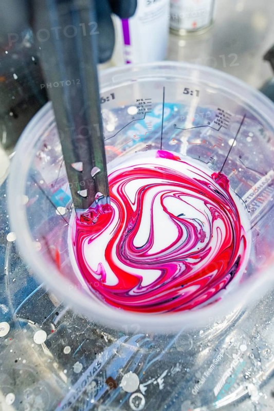 Color pattern with red and white in a measuring cup, preparation for mixing, painter, Calw, Germany
