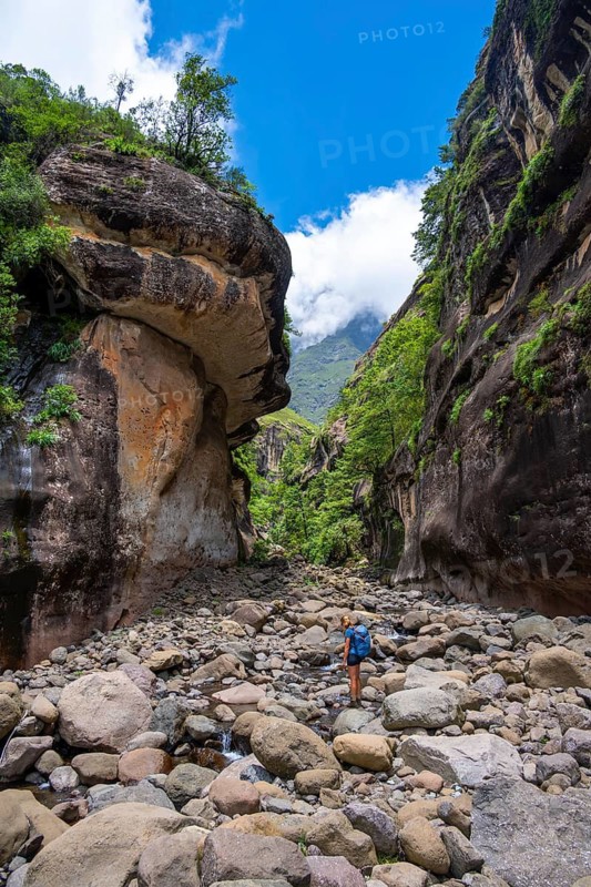 Female hiker in the Tugela Gorge or Tugela Gorge in the riverbed, Drakensberg National Park, KwaZulu Natal, South Africa