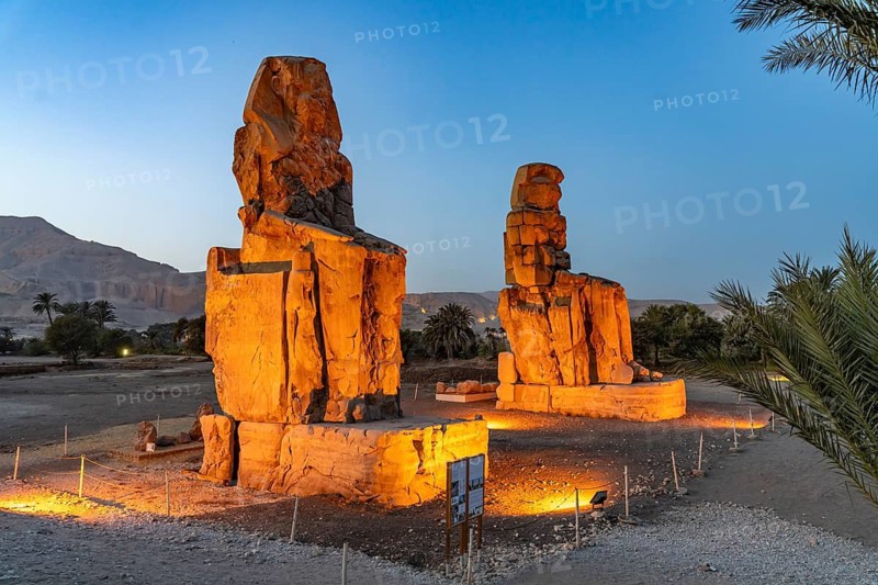 The Colossi of Memnon in the Nile Valley in West Thebes near Luxor at dusk, Egypt