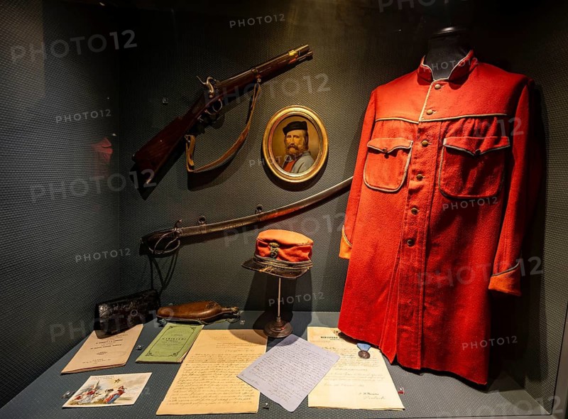 Personal equipment and memorabilia of a Friulian Garibaldino from the Volunteer Army by Giuseppe Garibaldis with red uniform jacket Camicia Rossa, Museo del Risorgimento, Castello di Udine, Friuli-Venezia Giulia, Italy