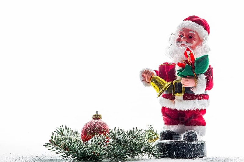 A funny Santa Claus, red Christmas ball, snow, Santa Claus