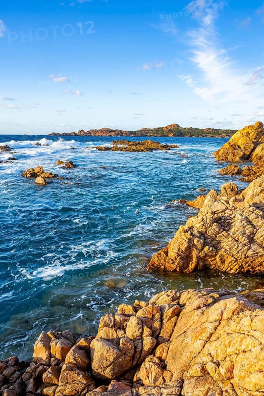 Landscape of the coastline with blue water at Marinedda Coast on a sunny day, Sardinia, Italy