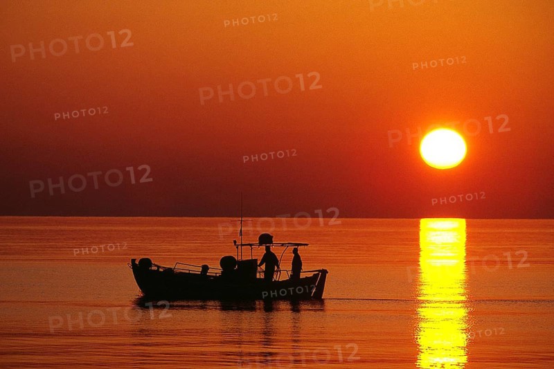 Greece - Crete - fishing boat in front of sunset, Crete, Greece
