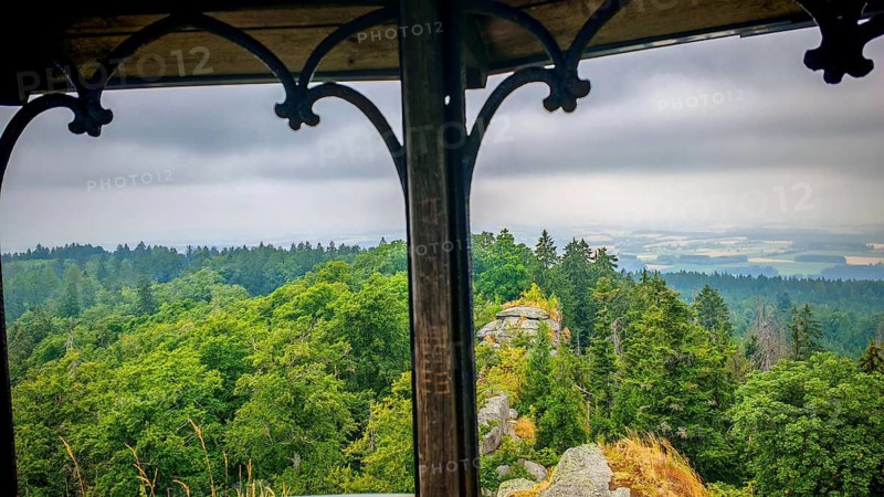 View from a viewpoint, Großer Waldstein, over a dense green forest with cloudy sky, Fichtelgebirge nature park Park, Upper Franconia