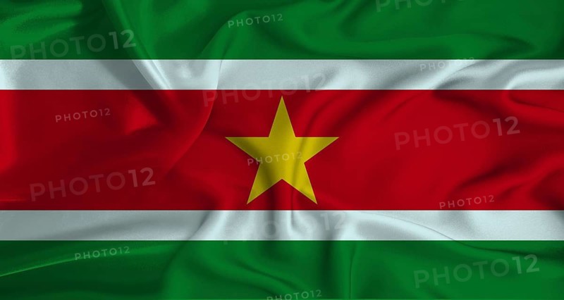 Realistic Suriname flag waving. Close up of flag of Suriname with cloth texture