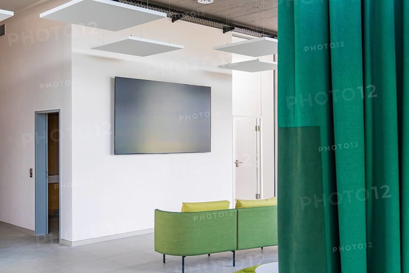 Modern room with green curtain and flat screen