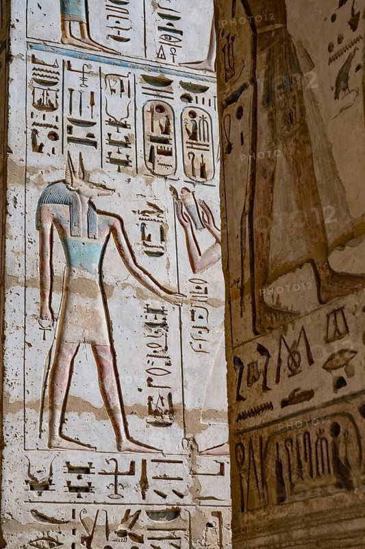 Close up details of ancient Egyptian history shown in reliefs and hieroglyphs inside Medinat Habu, the ancient Egyptian Mortuary Temple of Ramesses III on the West Bank of The Nile, Luxor, Egypt