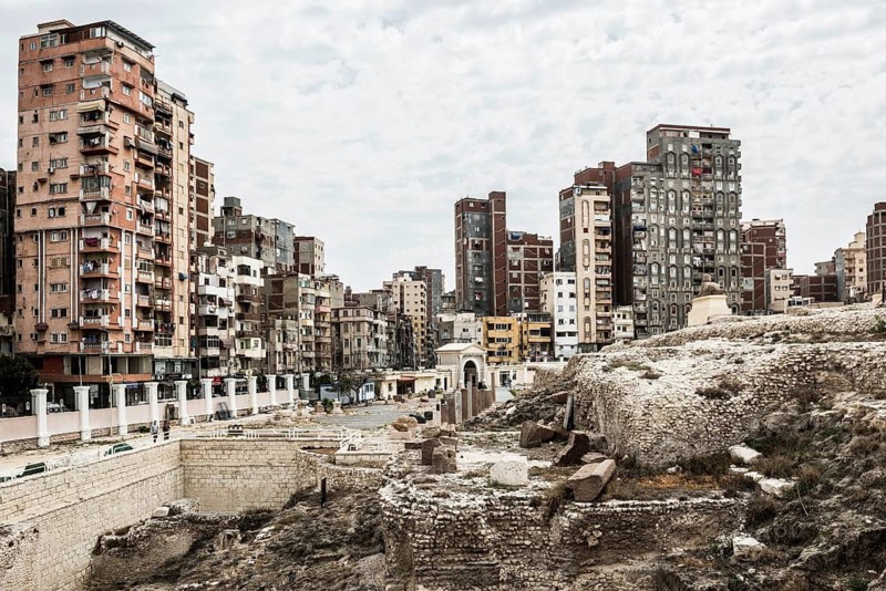 Roman archaeological site in the middle of the city and skyscrapers, Pompey's Column, Alexandria, Egypt