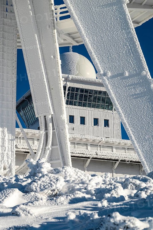 View of the radar station through the lower part of the telecommunications tower on the Brocken summit, winter, Harz National Park, Saxony-Anhalt, Germany