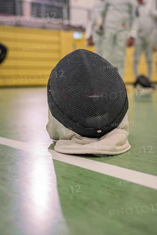 Fencing mask on a green hall floor, ready for fencing, TSV Calw, Calw district, Germany