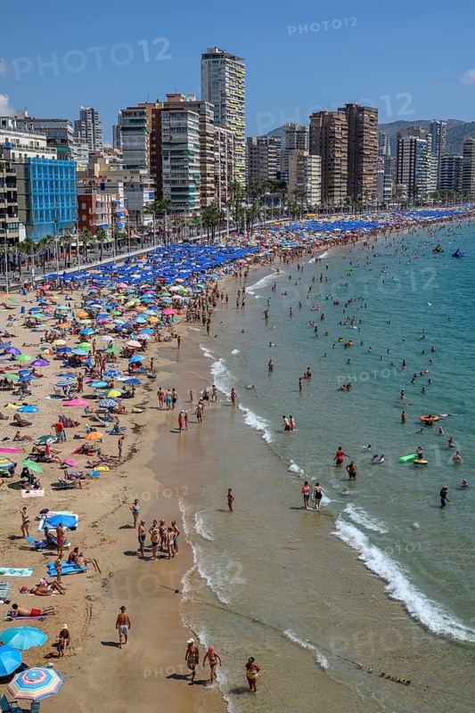 Many tourists on the beach in front of skyscrapers, Playa Levante, Benidorm, Alicante province, Costa Blanca, Spain