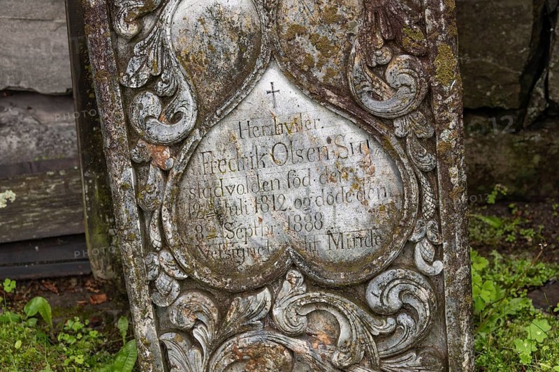Old gravestone at cemetery, wooden church, Kvam, upper Gudbrandsdalen valley, Norway