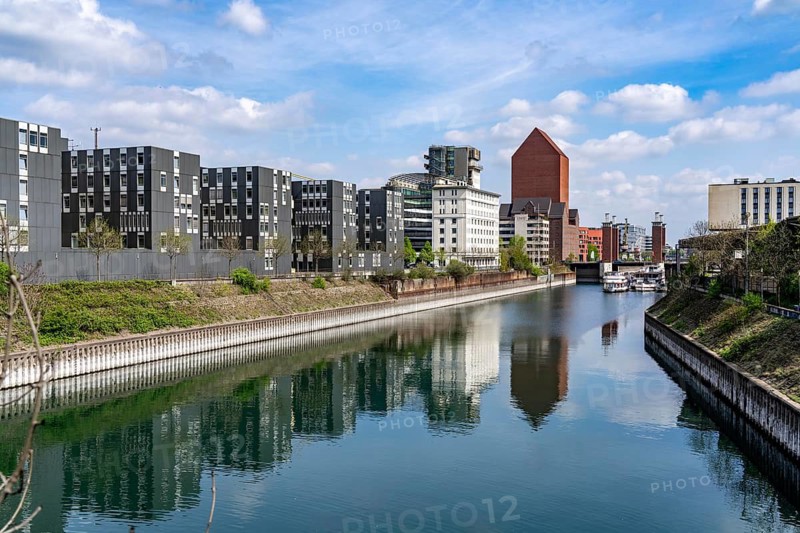 The Schwanentor Bridge in the inner harbour of Duisburg, one of 3 lifting bridges, can be raised up to 10 metres, freshly renovated, connects the city centre with the district of Kaßlerfeld, Ruhrort, tower of the former RWSG warehouse, today the seat of the State Archives of North Rhine-Westphalia, on the left the building of the LZPD, Germany