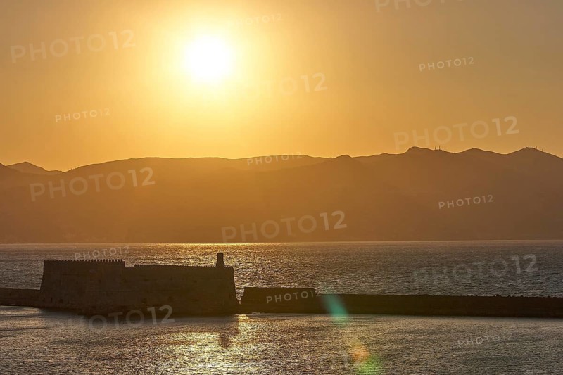 Sunset, evening light, backlight, Venetian sea fortress, Koules, Morosini, mountains, bronze sky, harbour, Heraklion, capital, island of Crete, Greece