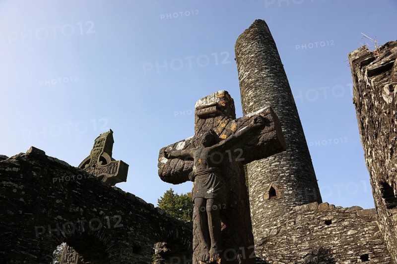Round Tower, High Cross of Muiredach, Mainistir Bhuithe, Monasterboice, a monastery ruin of the Iro-Scottish Church in Ireland in County Louth, founded by Saint Buite/Round Tower, Monasterboice, cemetery of the monastery ruins of the Iro-Scottish Church in Ireland in County Louth, founded by Saint Buite, abandoned in 1097 after a fire, but the cemetery is still in use today, Province of Leinster, Ireland