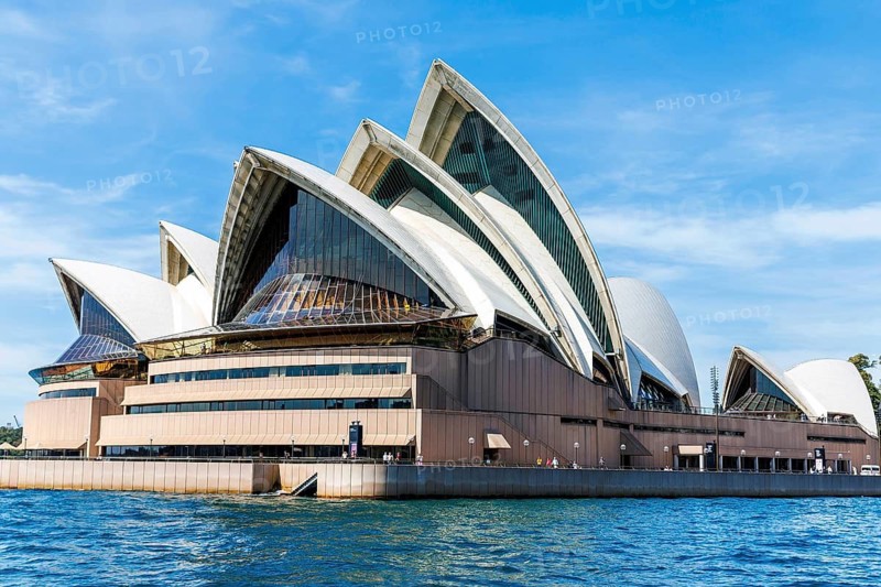 Iconic architectural masterpiece Sydney Opera House with its unique sail-like design on a sunny afternoon, Sydney, Australia
