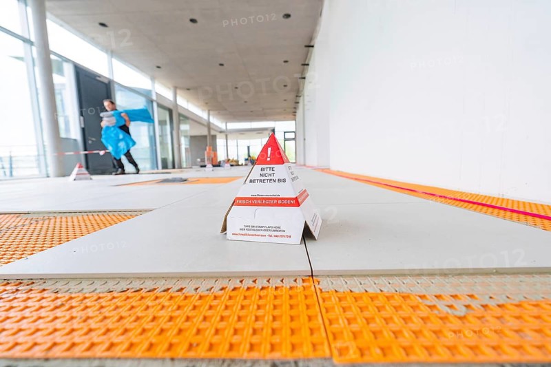 Interior view of a construction site with tiles and a warning sign on the ground, car park construction, Calw, Germany