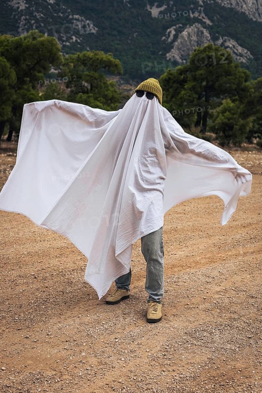 Creative homemade ghost costume for Halloween celebration outdoors. Simple family activity, seasonal traditions and low budget holiday inspiration.