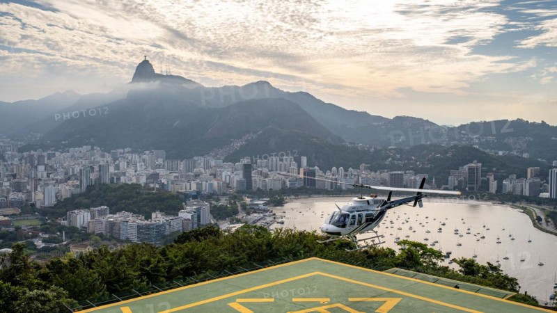 Helicopter lands on Sugar Loaf Mountain, Praia de Botafogo, Rio de Janeiro, Brazil
