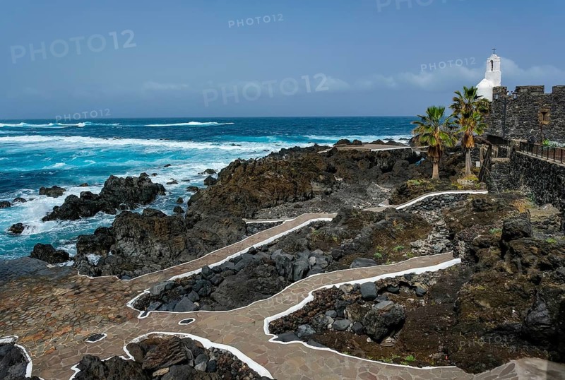 Garachico, Santa Cruz, Tenerife, Canary Islands, Spain - Garachico is a small, tranquil, picturesque town right by the sea in the northwest of the island. El Caletón public natural swimming pool, lava pools right by the sea. Swim in the open Atlantic. On the right, the tourist attraction Castillo de San Miguel