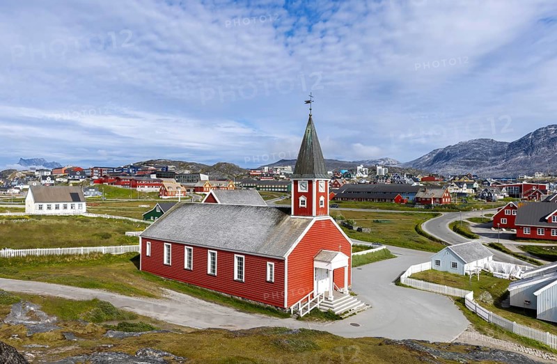 Typical architecture of Greenland capital Nuuk with colored houses located near fjords and icebergs