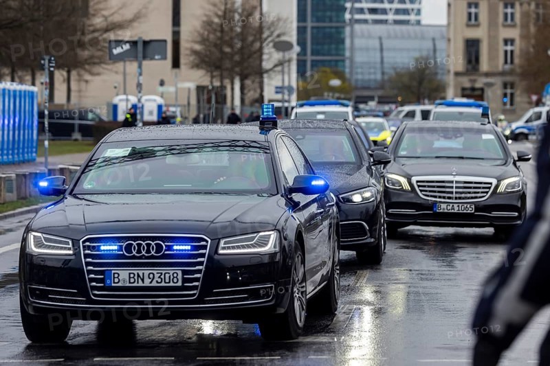 Departure from the Federal Chancellery. Syrian interim president Ahmed al-Sharaa on the road in Berlin with a powerful escort. State limousines with flashing lights. Berlin, Germany