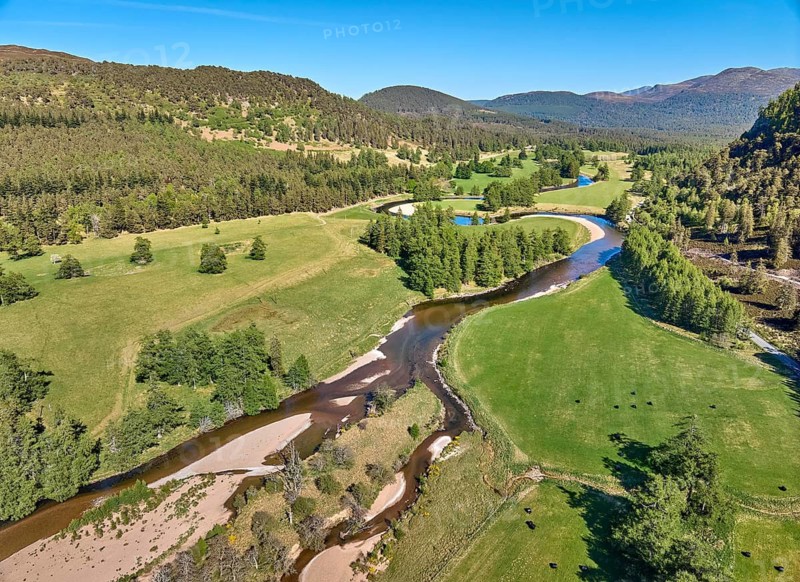 Aerial drone view of the course of Clunie River near Braemar, Cairn Gorms national Park, Scotland, UK