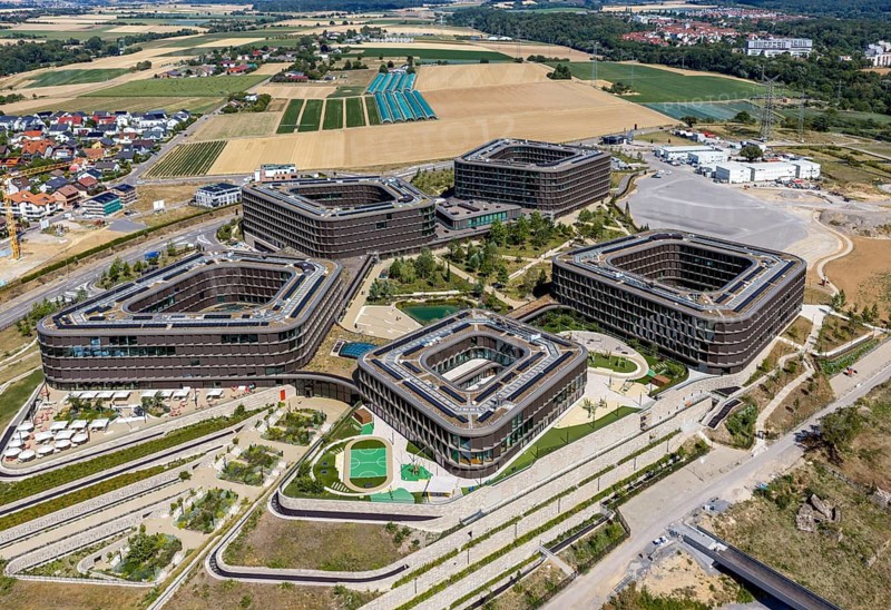Reopening of the Schwarz Digits Campus of the Schwarz Group in Bad Friedrichshall. The IT solutions of tomorrow are to be worked on here. 3000 people work here, later there will be 5500 jobs. Aerial view of campus with modern architecture. Bad Friedrichshall, Baden-Württemberg, Germany