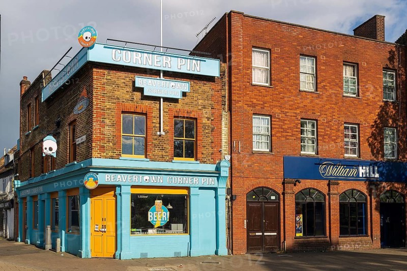 The brightly painted Corner Pin pub, run by Beavertown Brewery, stands on the corner near the stadium, England, United Kingdom